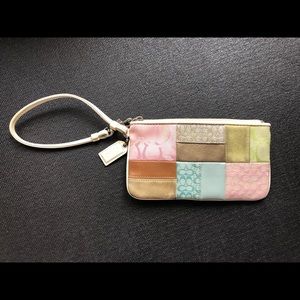 Coach colorful patchwork wristlet w/ shades of pink, green, blue and beige/brown